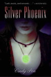 book
cover showing a close-up of a glowing green pendant being worn by a person
of indeterminate ethnicity