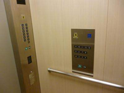 two elevator button panels