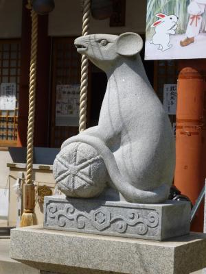 rat guardian with bag of rice